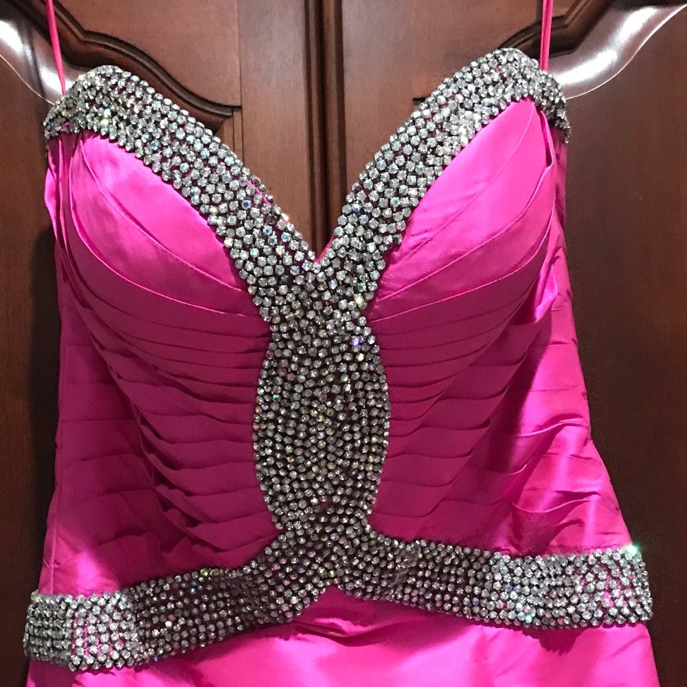 Strapless, Hot pink pageant/prom gown was returned due2 a couple beads missing.